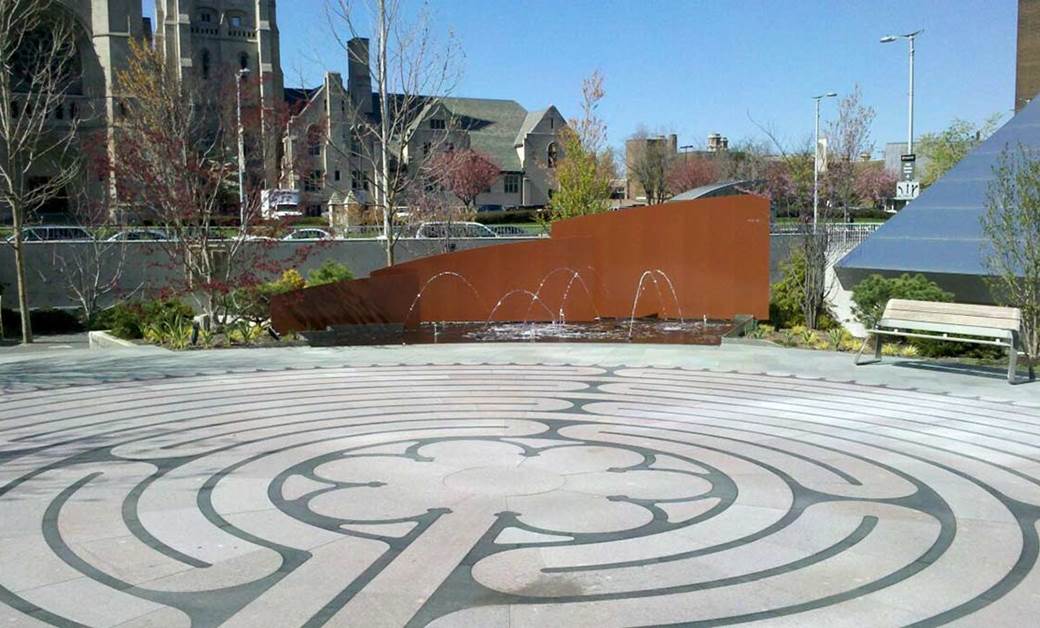 Seidman II courtyard with circular floor pattern and bench